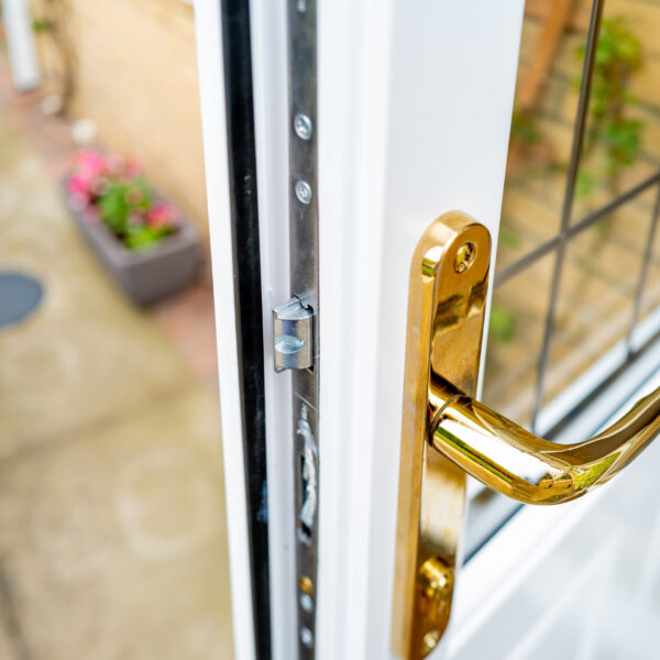 Shallow focus of the brass coloured door handle on a newly insta