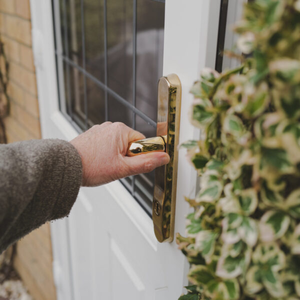 Homeowner opening a rear of property double glazed and leaded wi